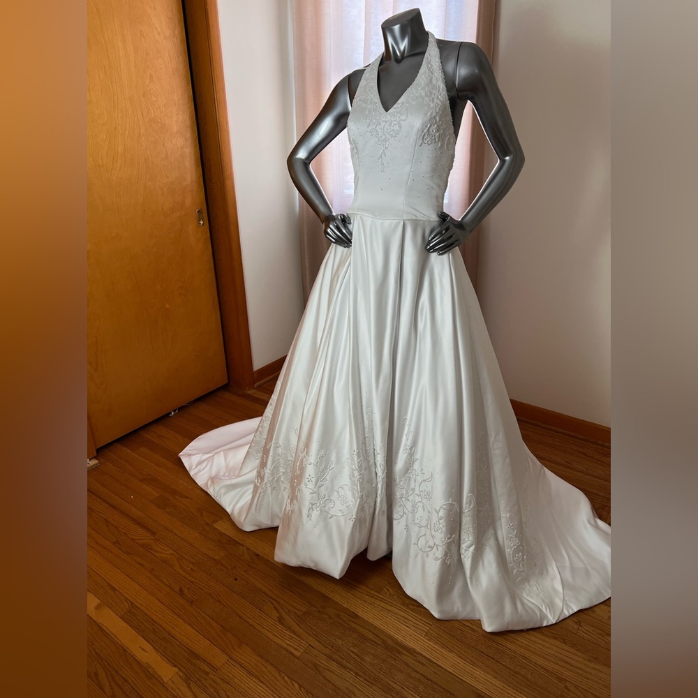 Elegant White Halter style ballgown with cathedral train.